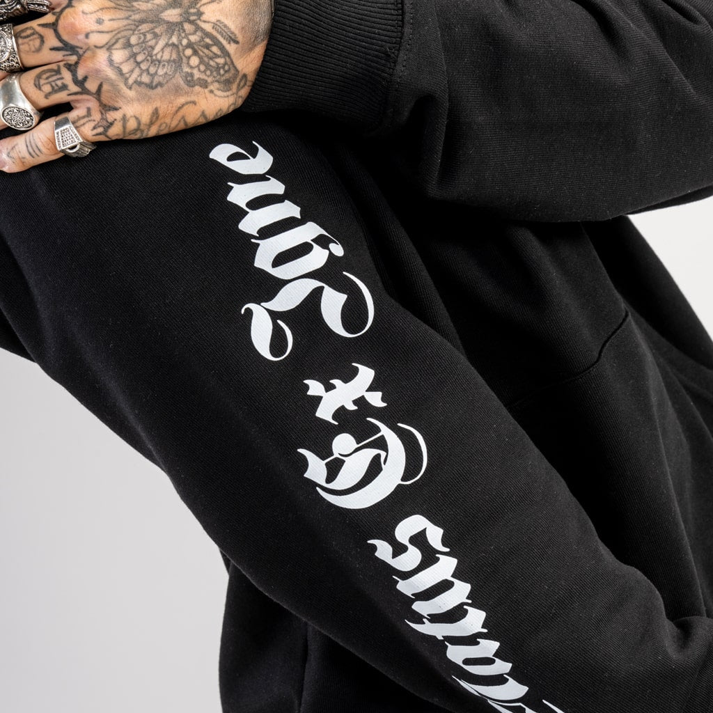 arm detail on black streetwear sweatshirt