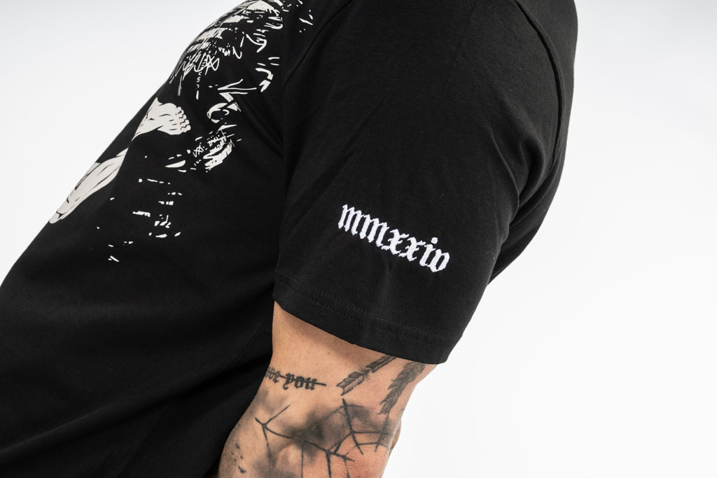 Roman Numeral embroidery detail on a GOD t shirt