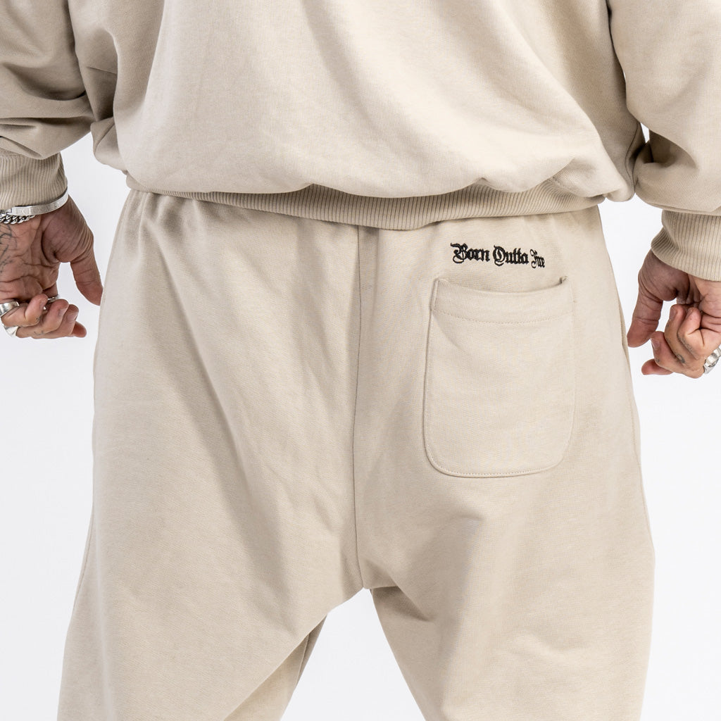 Back detail on sand coloured French terry tracksuit bottoms