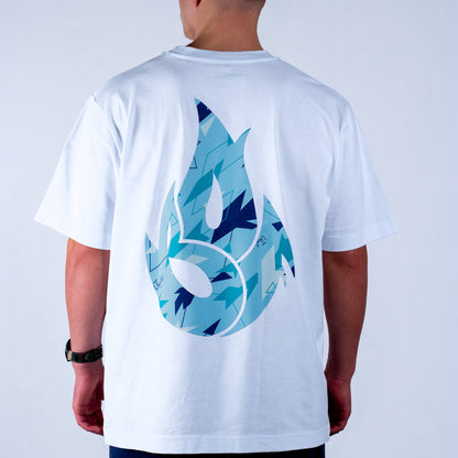 White t-shirt with blue and black  camo abstract design on the back, worn by a person.