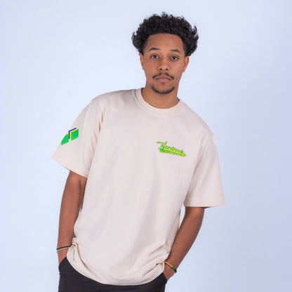 Person wearing a beige t-shirt with yardrock clothing logos on a light blue background