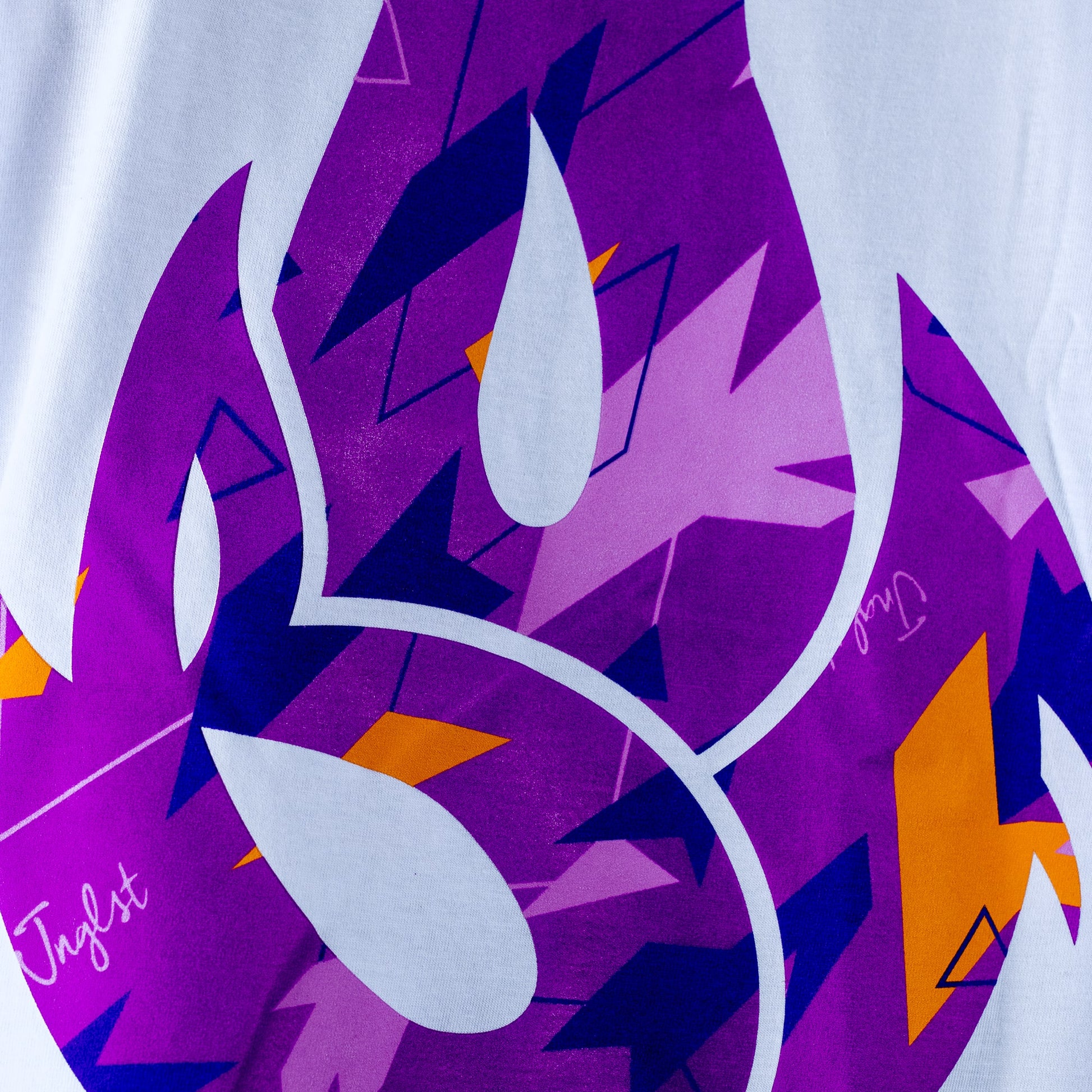 Colorful abstract purple camo design with geometric shapes on a white background