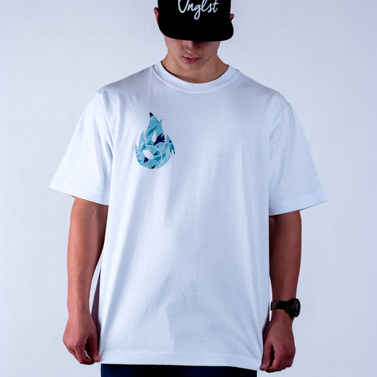 Person wearing a white t-shirt with a blue camo graphic design on a plain background