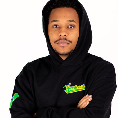 Person wearing a black yardrock diamond hoodie with a visible brand logo on a white background